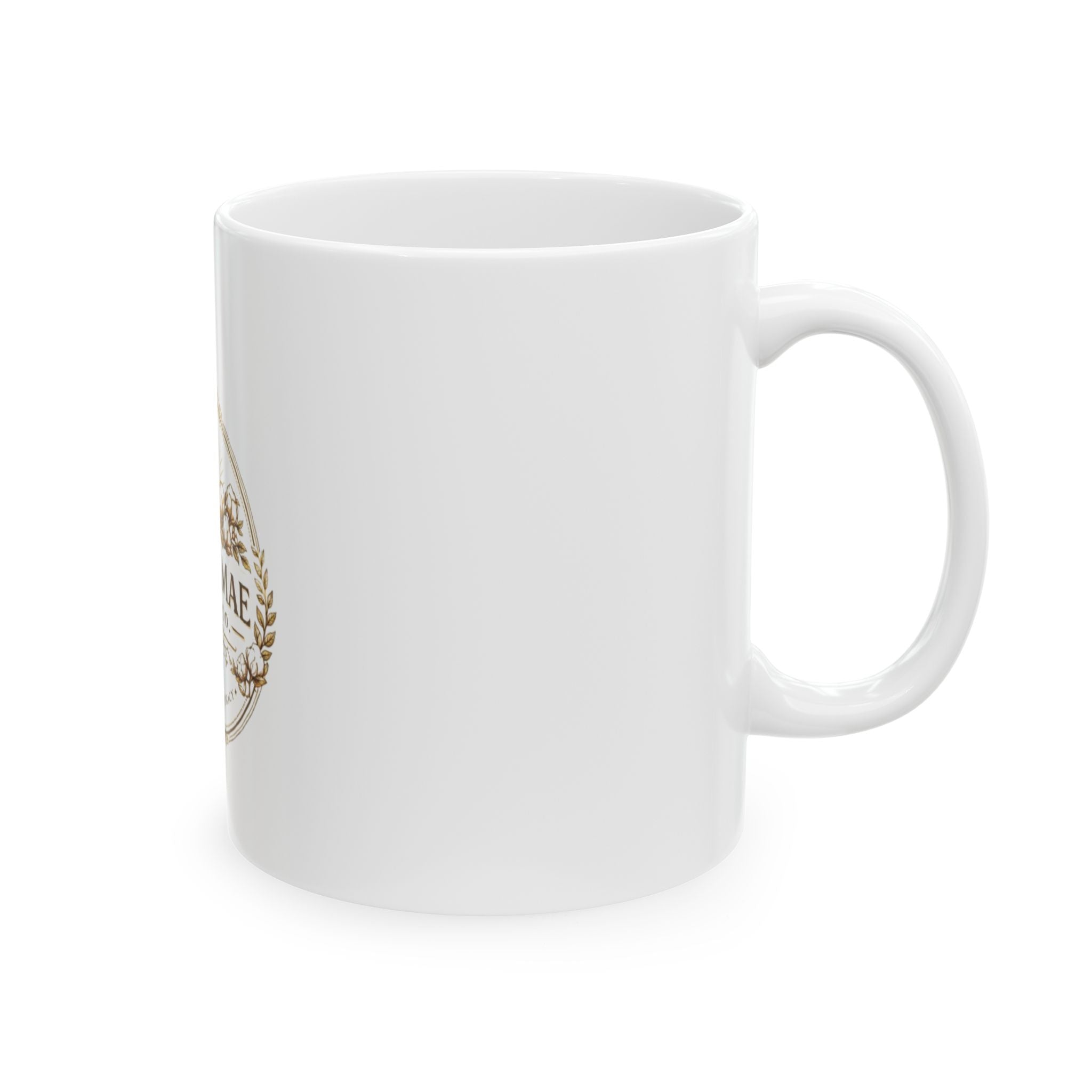White mug with a gold and brown design on a white background